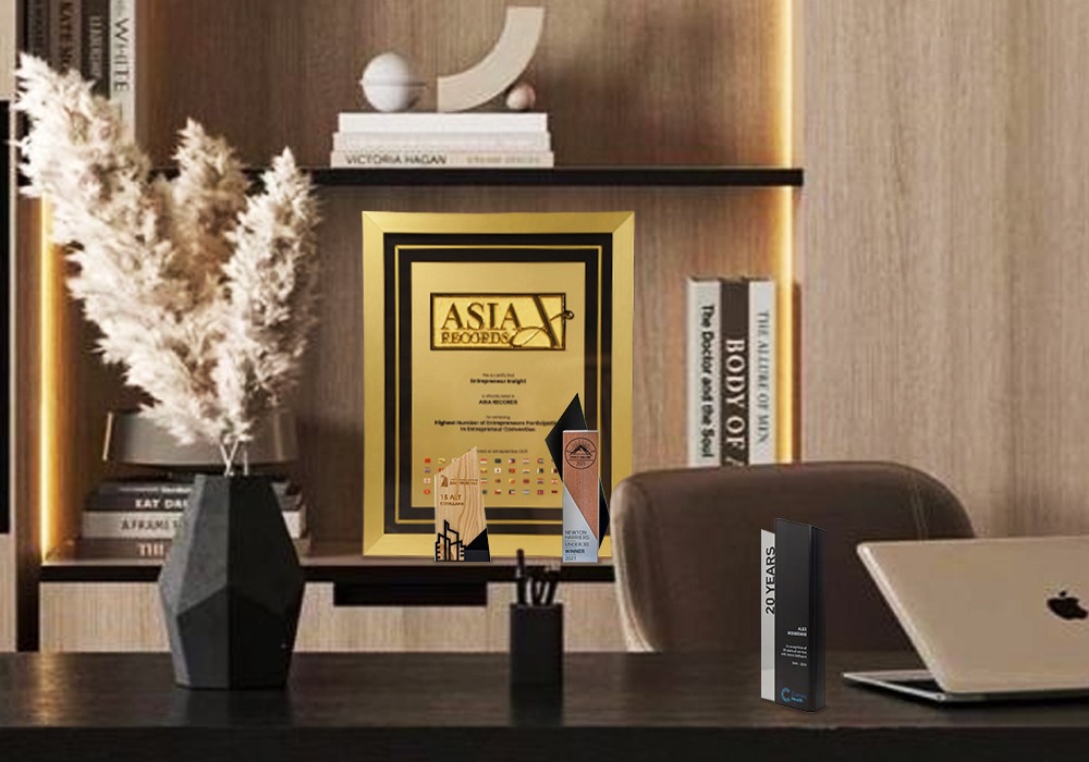 The Asia Records Certificate proudly sits among other awards in a office background